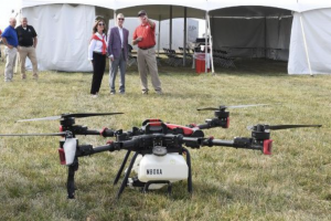 The Ohio State University President and Lynda Carter learn more about precision agriculture at the Farm Science Review. Photo: The Ohio State University.